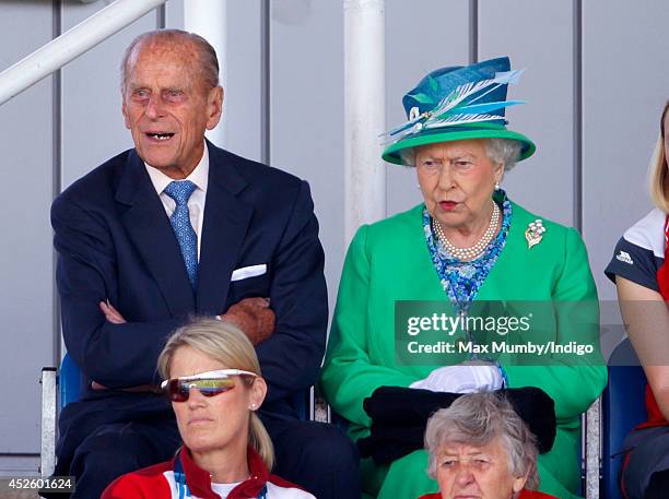 Prince Philip, Duke of Edinburgh and Queen Elizabeth II watch the England vs Wales women's hockey match at the Glasgow National Hockey Centre during...