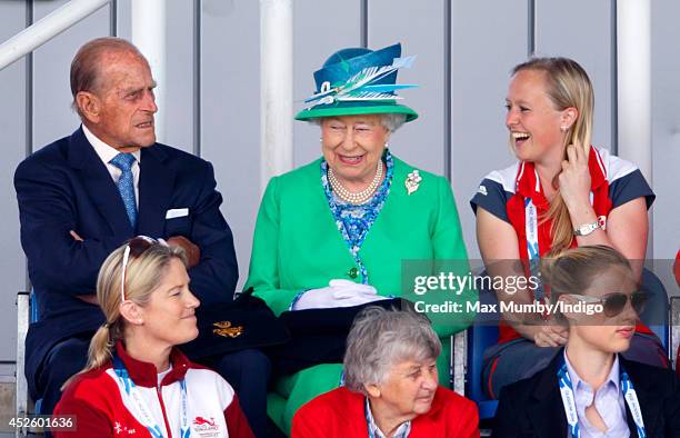 Prince Philip, Duke of Edinburgh and Queen Elizabeth II watch the England vs Wales women's hockey match at the Glasgow National Hockey Centre during...