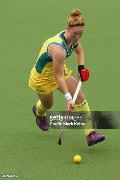 Georgia Nanscawen of Australia runs with the ball during the Women's preliminary match between Australia and Malaysia at Glasgow National Hockey...