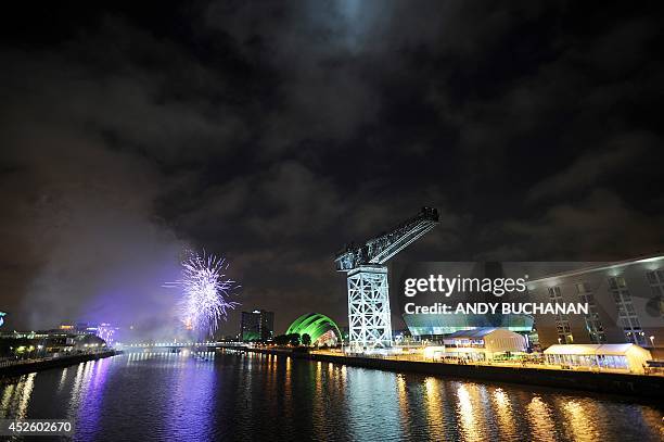 Fireworks explode over the River Clyde next to the SECC venues to mark the opening of the 2014 Commonwealth Games in Glasgow on July 23, 2014. AFP...