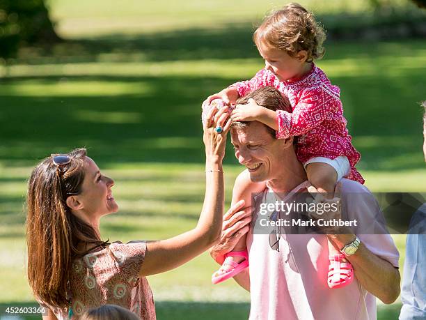 Prince Joachim of Denmark and Princess Marie of Denmark with Princess Athena of Denmark attend the annual Summer photo call for the Royal Danish...