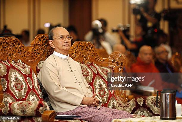 Myanmar President Thein Sein listens before giving a speech during a meeting with local civil society organizations at the Diamond Jubilee Hall of...
