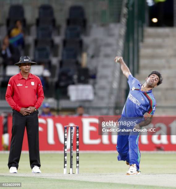 Dawlat Zadran of Afghanistan bowling during the Ireland v Afghanistan Final at the ICC World Twenty20 Qualifiers at the Zayed Cricket Stadium on...
