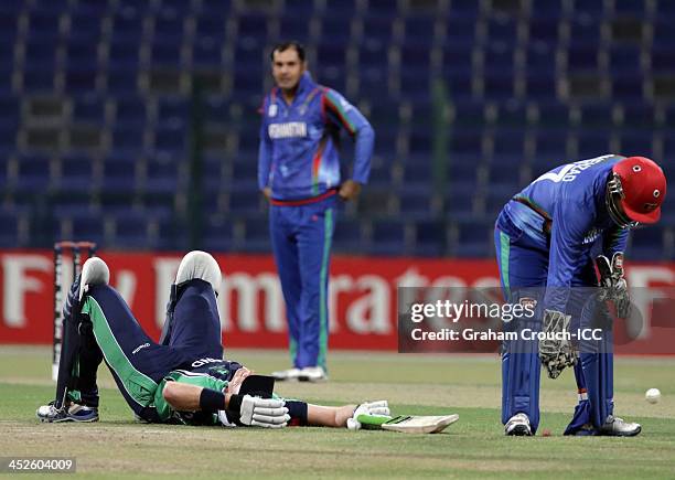 Trent Johnston of Ireland lies on the ground after surviving a run out attempt during the Ireland v Afghanistan Final at the ICC World Twenty20...