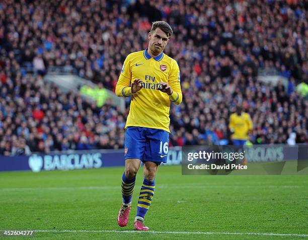 Aaron Ramsey doesn't celebrate scoring Arsenal's goal during the match Cardiff City against Arsenal at Cardiff City Stadium on November 30, 2013 in...