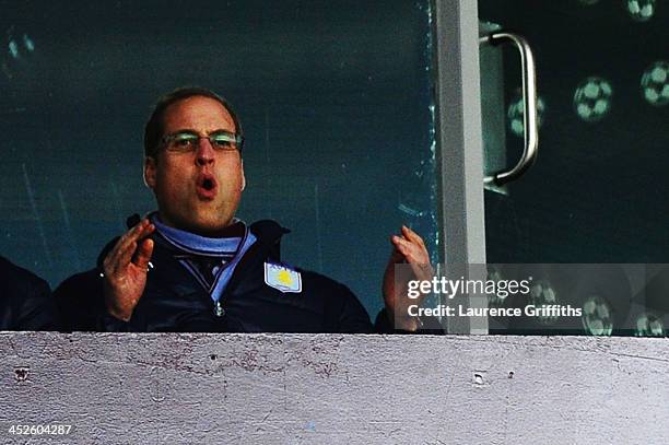 Prince William, Duke of Cambridge reacts as he watches the Barclays Premier League match between Aston Villa and Sunderland at Villa Park on November...