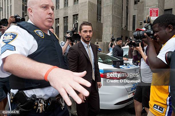 Shia LaBeouf is seen leaving Manhattan Criminal Court on July 24, 2014 in New York City. LaBeouf was charged with criminal trespass, disorderly...