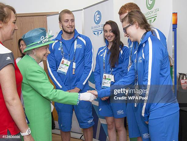 Queen Elizabeth II meets Scottish Swimmers during a visit the Tollcross International Swimming Centre during day one of the 20th Commonwealth Games...
