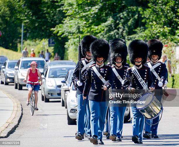 The Royal Danish Lifeguards march through the streets of Grasten in Denmark to the change of guards at Grasten Castle on July 24, 2014 in Grasten,...