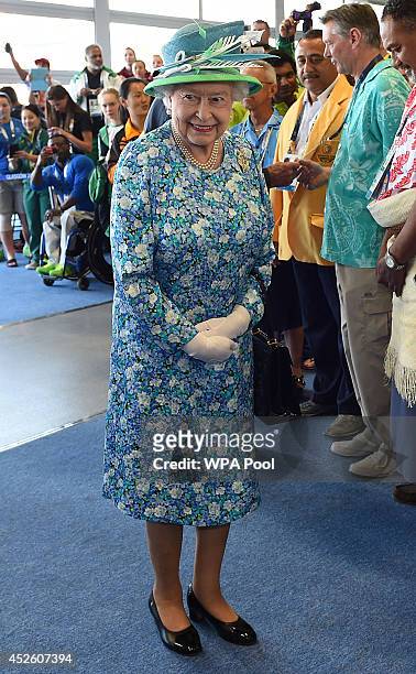 Queen Elizabeth II meets delegates and athletes on a visit to the Athlete's village during day one of the 20th Commonwealth Games on July 24, 2014 in...