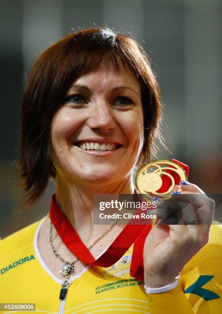 Gold medalist Anna Meares of Australia celebrates on the podium after winning in the Women's 500m Time Trial at Sir Chris Hoy Velodrome during day...
