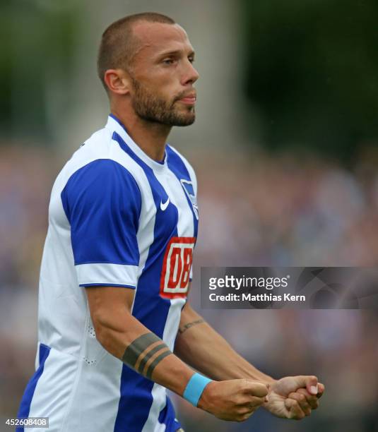 John Heitinga of Berlin jubilates after scoring the first goal during the pre season friendly match between Hertha BSC and PSV Eindhoven at Stadion...