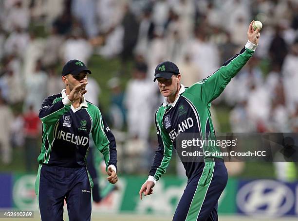 John Mooney of Ireland shows the ball to the crowd after taking a catch during the ICC World Twenty20 Qualifier Final between Ireland and Afghanistan...