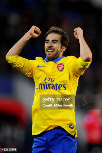 Mathieu Flamini of Arsenal elebrates as he scores their second goal during the Barclays Premier League match between Cardiff City and Arsenal at...