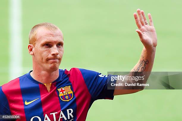 Jeremy Mathieu poses as a new player of FC barcelona at the Camp Nou on July 24, 2014 in Barcelona, Spain.