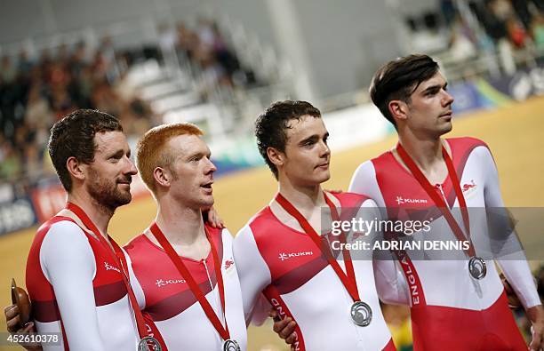 England's Bradley Wiggins, Ed Clancy, Steven Burke and Andy Tennant pose on the podium after winning the silver medal in the men's 4000m team pursuit...