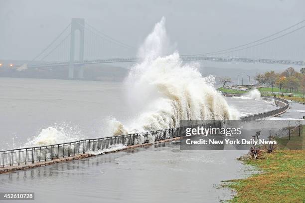 Areas along the Belt Parkway near Verrazano Bridge in Gravesend Bay, were already breached by 9 a.m. This morning, 12 hours before Hurricane Sandy is...