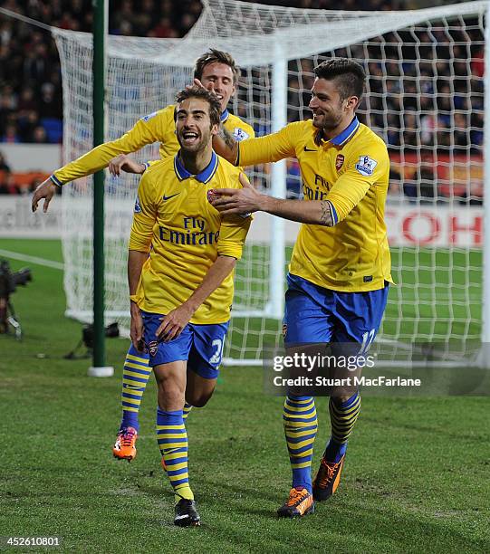 Mathieu Flamini celebrates scoring the 2nd Arsenal goal with Olivier Giroud during the match at Cardiff City Stadium on November 30, 2013 in Cardiff,...