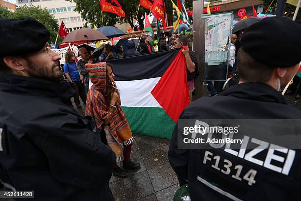 Participants protest against continued violence in Gaza at a demonstration organized by left-wing activists on July 24, 2014 in Berlin, Germany. At...