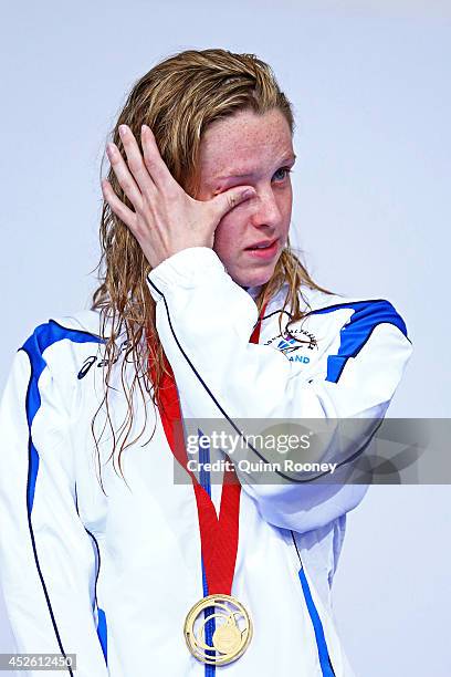 Gold medallist Hannah Miley of Scotland wipes away tears during the medal ceremony for the Women's 400m Individual Medley Final at Tollcross...