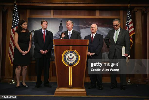 Sen. Lindsey Graham speaks as Sen. Kelly Ayotte , Sen. Richard Blumenthal , Sen. Benjamin Cardin and Sen. Charles Schumer listen during a news...