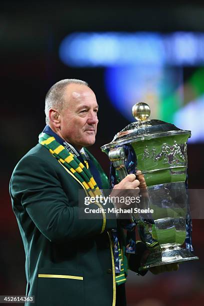 Tim Sheens the head coach of Australia with the winners trophy after his sides 34-2 victory during the Rugby League World Cup Final between Australia...