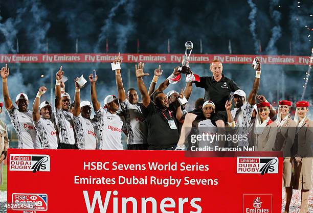 Fiji celebrate after winning the second round of the HSBC Sevens World Series at the Emirates Dubai Rugby Sevens on November 30, 2013 in Dubai,...