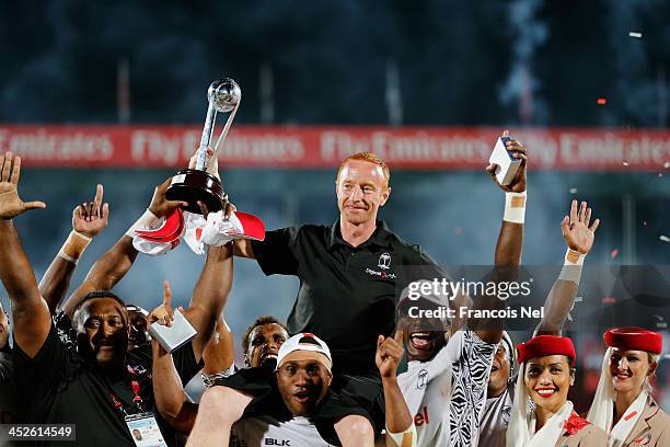 Fiji Head coach Ben Ryan celebrate after winning the second round of the HSBC Sevens World Series at the Emirates Dubai Rugby Sevens on November 30,...