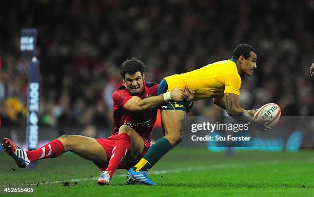 Wallabies scrum half Will Genia is tackled by Mike Phillips of Wales during the International match between Wales and Australia Wallabies at...