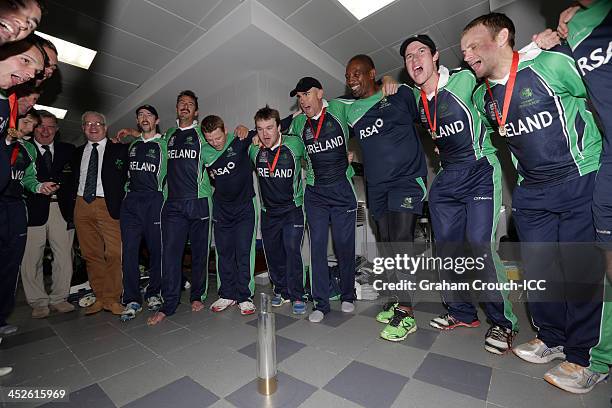 The Irish team celebrate with a song in the dressing rooms after their victory over Afghanistan in the Ireland v Afghanistan Final at the ICC World...