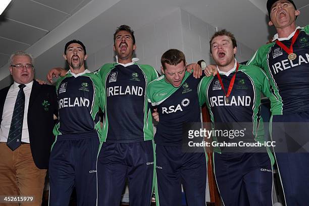 The Irish team celebrate with a song in the dressing rooms after their victory over Afghanistan in the Ireland v Afghanistan Final at the ICC World...