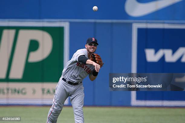 Stephen Drew of the Boston Red Sox throws out the baserunner in the first inning during MLB game action against the Toronto Blue Jays on July 24,...