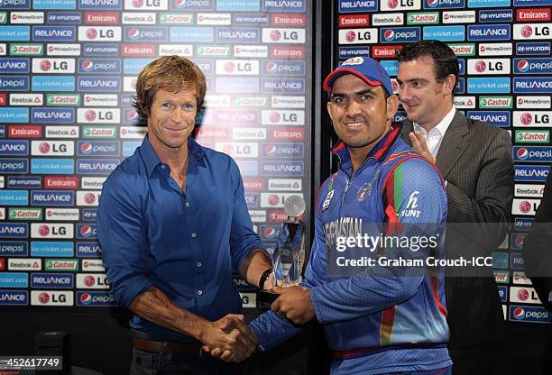 Samiullah Shenwari of Afghanistan was awarded Player of the Tournament by Jonty Rhodes following the Ireland v Afghanistan Final , won by Ireland at...