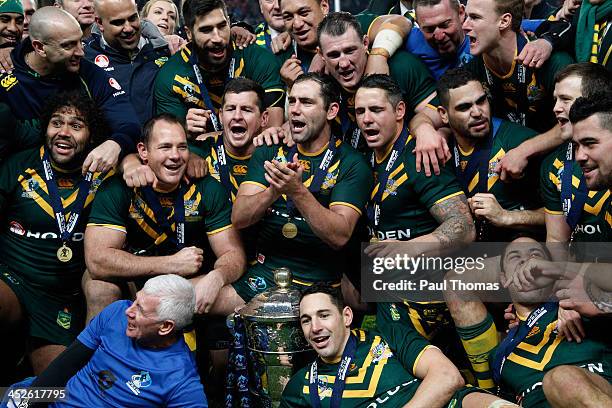 Captain Cameron Smith of Australia celebrates with team mates and the trophy after the Rugby League World Cup final between New Zealand and Australia...