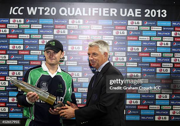 Dave Richardson CEO of the ICC presents William Porterfield, Captain of Ireland with the trophy after Irelands victory in the Ireland v Afghanistan...