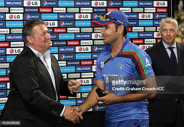 David East presents Captain of Afghanistan Mohammad Nabi with his runners up medal after Irelands victory in the Ireland v Afghanistan Final at the...