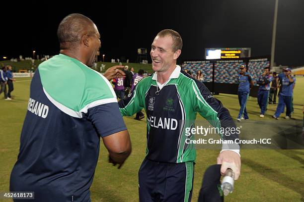 John Mooney shakes hands with coach Phil Simmonds after Irelands victory in the Ireland v Afghanistan Final at the ICC World Twenty20 Qualifiers at...