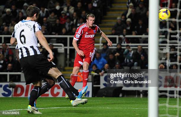 Chris Brunt of West Bromwich Albion scores his team's first goal during the Barclays Premier League match between Newcastle United and West Bromwich...