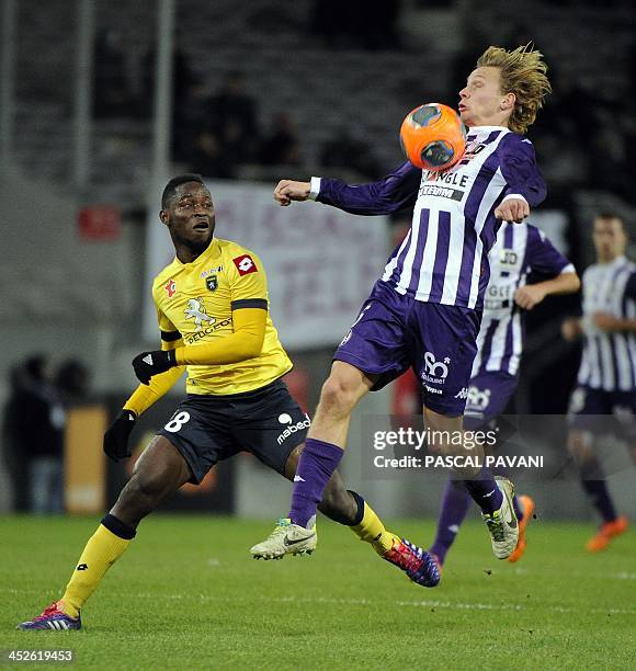 Toulouse's French midfielder Clement Chantone vies with Sochaux's midfelder Joseph Lopy during a French L1 football match between Toulouse and...