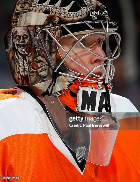 Goalie Steve Mason of the Philadelphia Flyers waits during a break in the game as the Flyers defeated the Winnipeg Jets in an NHL hockey game at...
