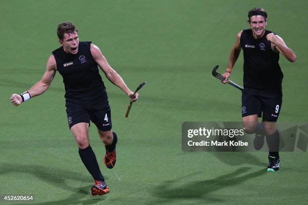 Nick Haig and Blair Hilton of New Zealand celebrate after Phil Burrows scored a goal during the Men's preliminary match between New Zealand and...