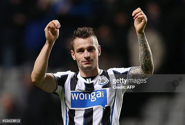 Newcastle United's French defender Mathieu Debuchy celebrates at full time during the English Premier League football match between Newcastle United...