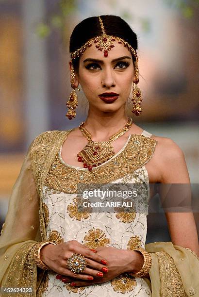 Model presents a creation by designer Bina Sultan at the Pantene Bridal Couture Week 2013 in Lahore on late November 30, 2013. AFP PHOTO/Arif ALI