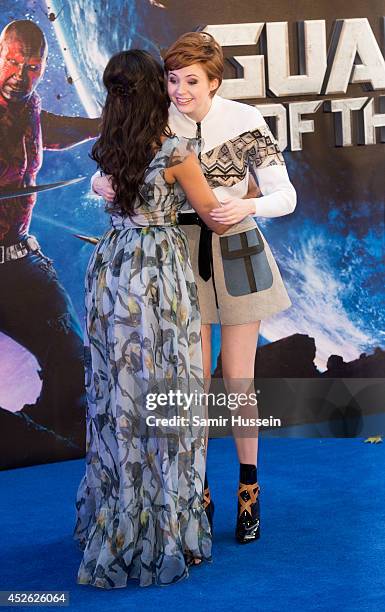 Zoe Saldana and Karen Gillan attends the UK Premiere of "Guardians of the Galaxy" at Empire Leicester Square on July 24, 2014 in London, England.