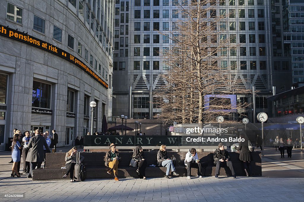 Employees enjoy a warm evening sun in Reuters Plaza in...