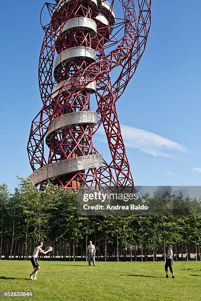 As the temperature soars over 25 degrees, during the hottest day of the year, people get fresh in the Olympic Village in Stratford. On the background...