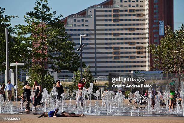 As the temperature soars over 25 degrees, during the hottest day of the year, people get fresh in the Olympic Village in Stratford.