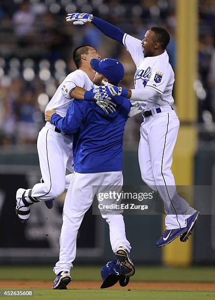 July 24: Norichika Aoki of the Kansas City Royals celebrates with Danny Duffy and Jarrod Dyson after hitting a game-winning RBI single in the 14th...