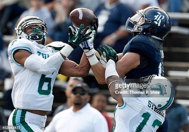 Lorenzo Doss and Derrick Strozier of the Tulane Green Wave break up a pass intended for Jordan Taylor of the Rice Owls on November 30, 2013 at Rice...