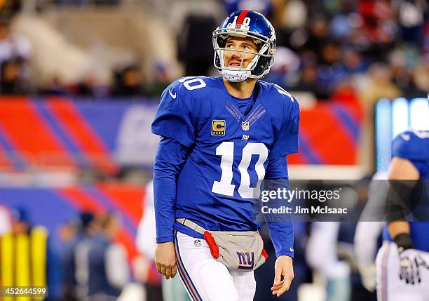 Eli Manning of the New York Giants looks on against the Dallas Cowboys on November 24, 2013 at MetLife Stadium in East Rutherford, New Jersey. The...